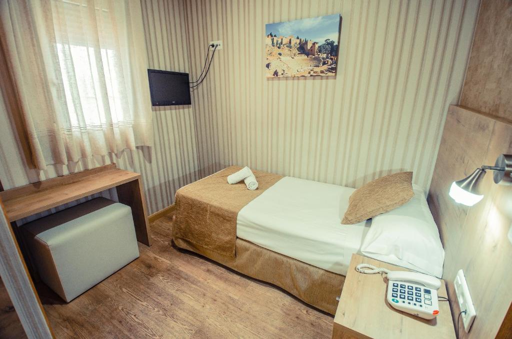 Postel nebo postele na pokoji v ubytování Hotel Solymar