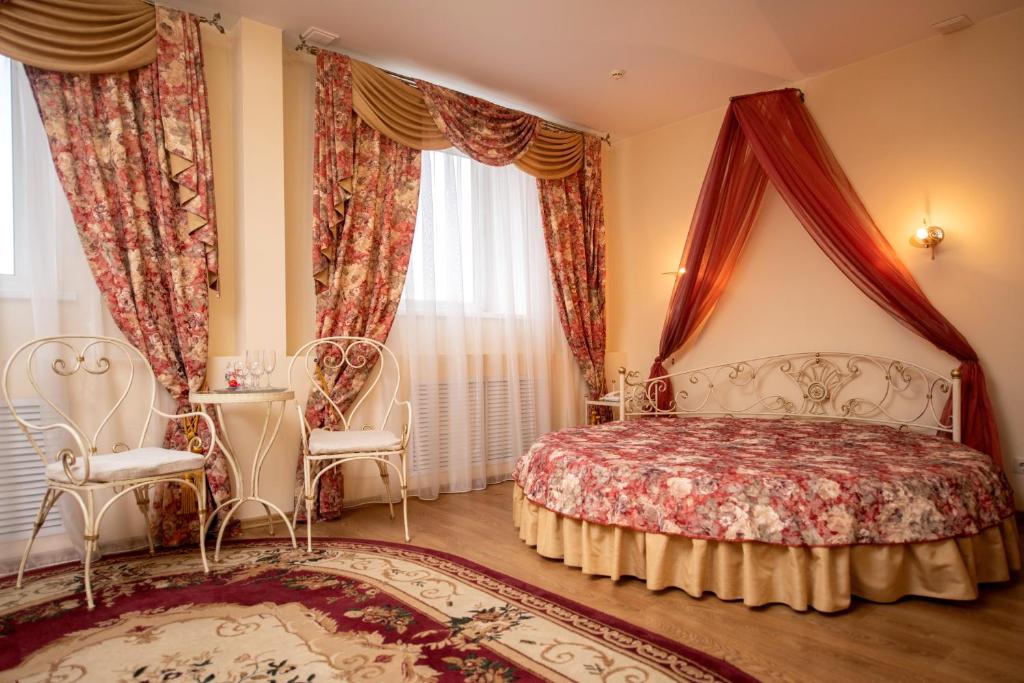 Кровать или кровати в номере Князь Владимир