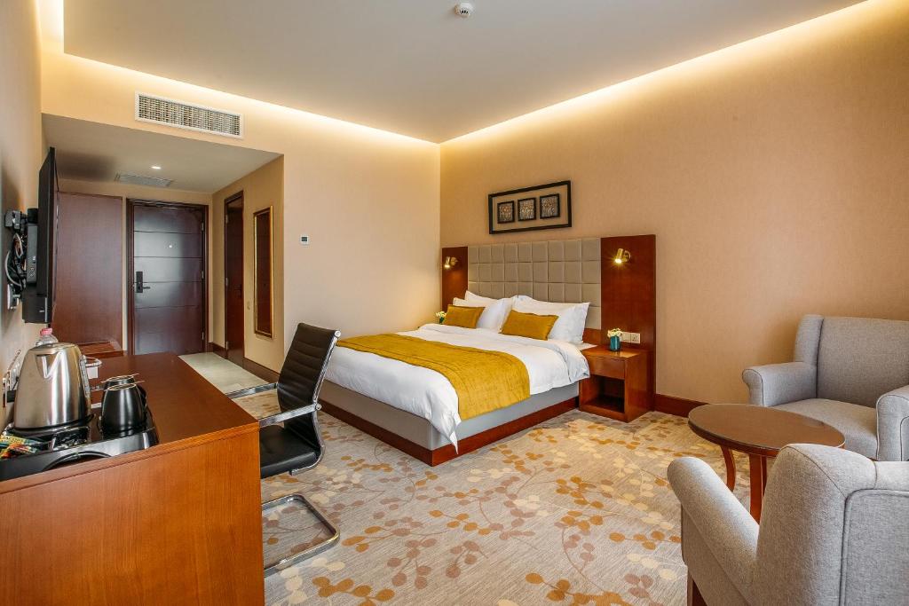 Postel nebo postele na pokoji v ubytování Horizont Hotel Tbilisi