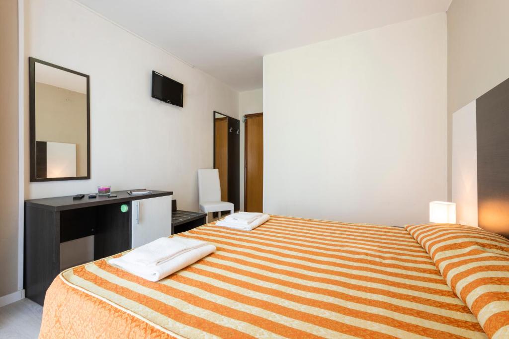Postel nebo postele na pokoji v ubytování Hotel Columbus