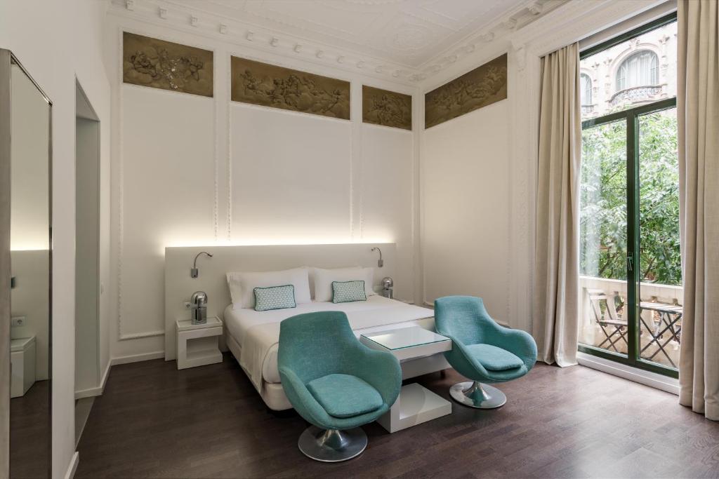Postel nebo postele na pokoji v ubytování Room Mate Carla, Barcelona