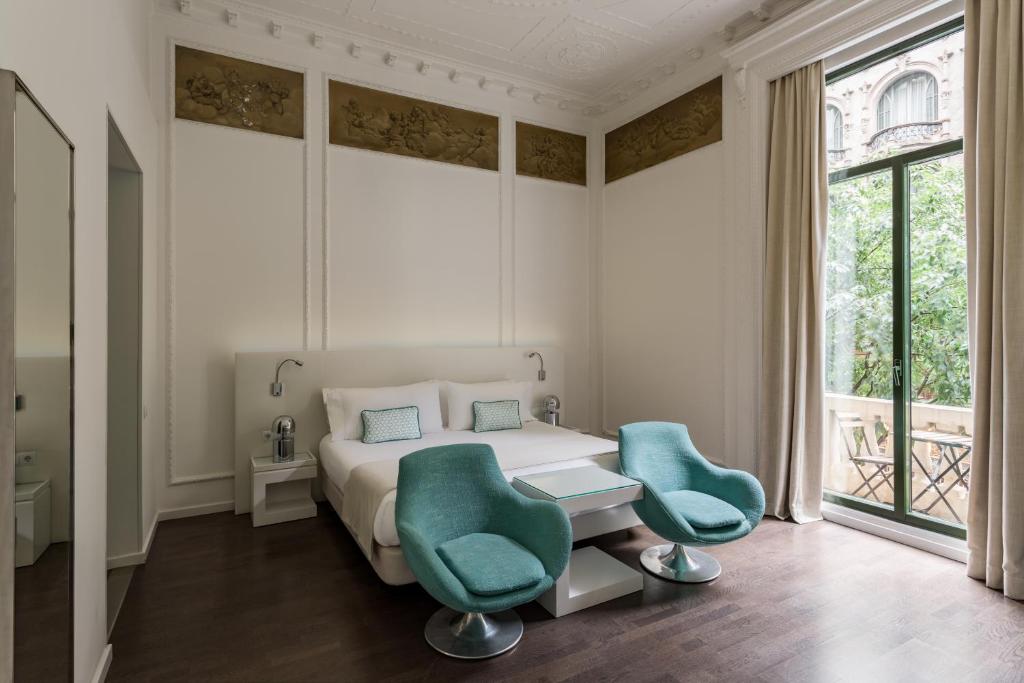 Postel nebo postele na pokoji v ubytování Room Mate Carla, Barcelona