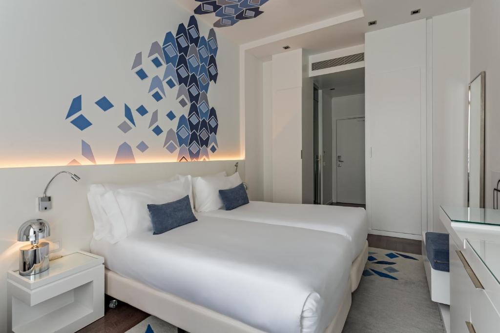 Postel nebo postele na pokoji v ubytování Room Mate Carla, Barcelona