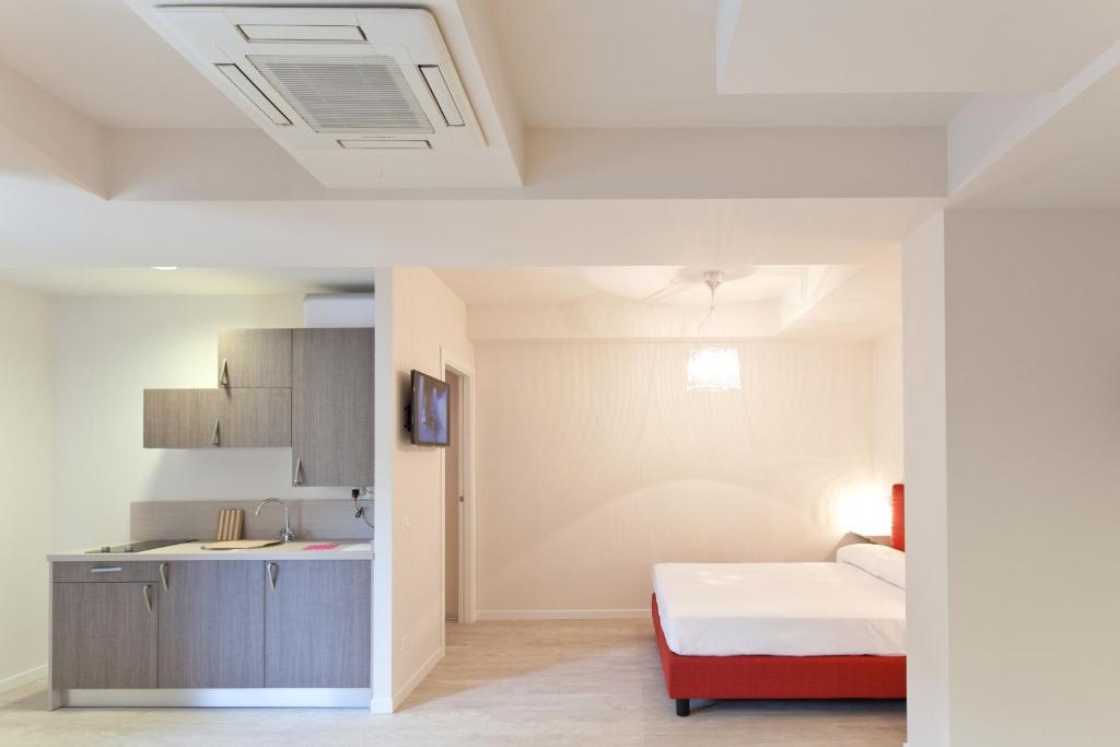 Een bed of bedden in een kamer bij Residence Lenno