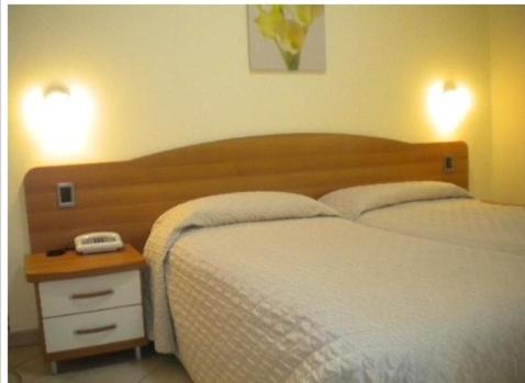 Postel nebo postele na pokoji v ubytování Hotel Ristorante Sbranetta