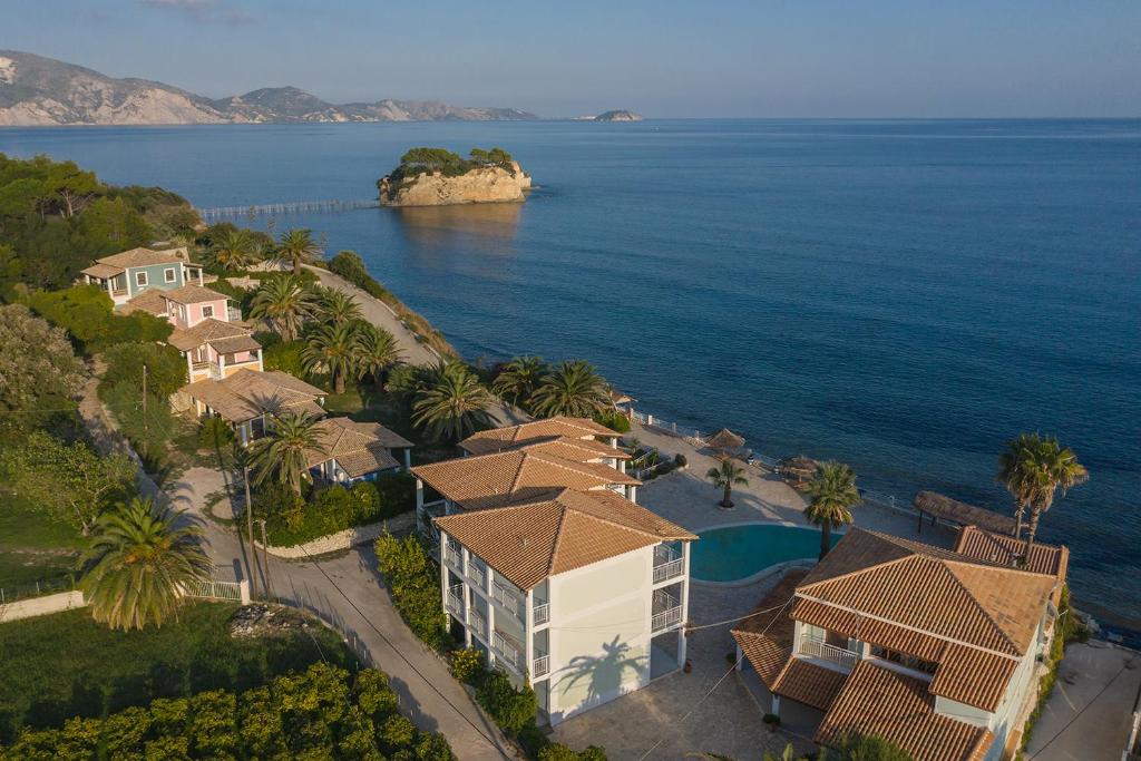 an aerial view of a house and the ocean at Korfiati Apartments in Laganas