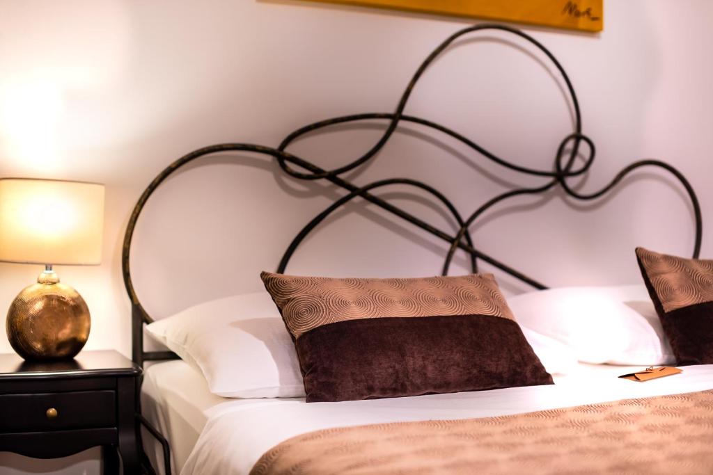 Postel nebo postele na pokoji v ubytování Hotel Heritage Forza