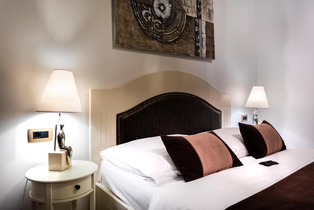 Postel nebo postele na pokoji v ubytování Hotel Heritage Forza