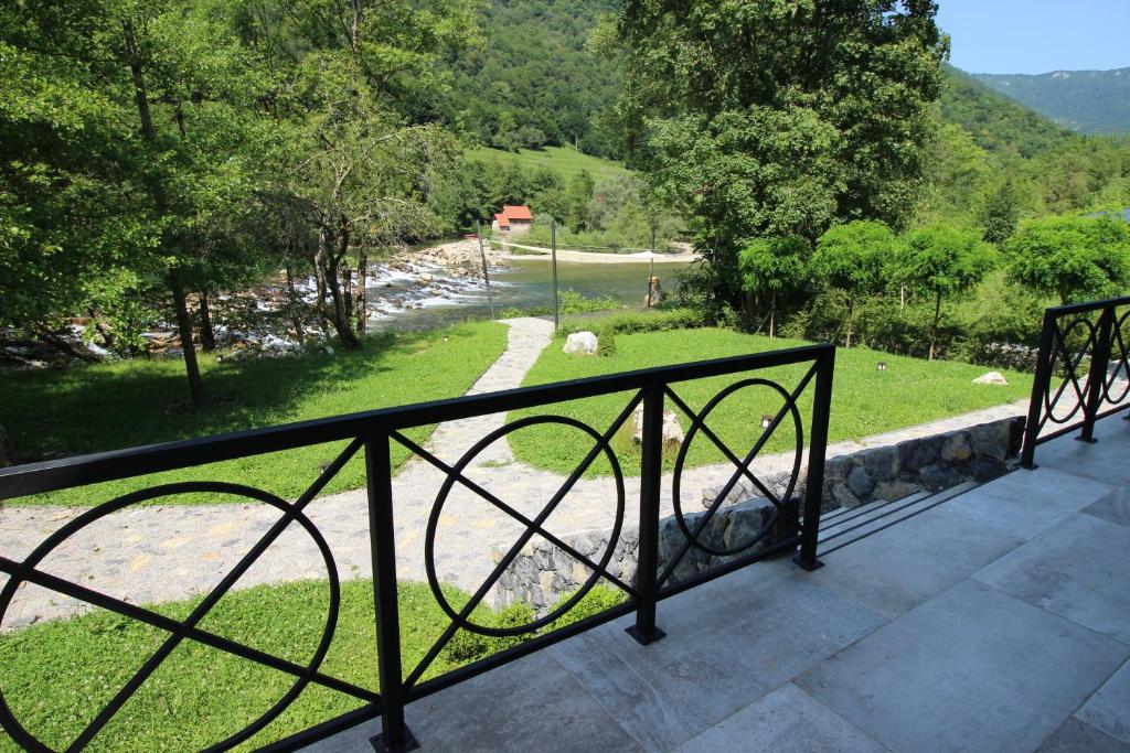 a balcony with a view of a field and trees at Villa VEGA - Gorseti in Gornji Šajn