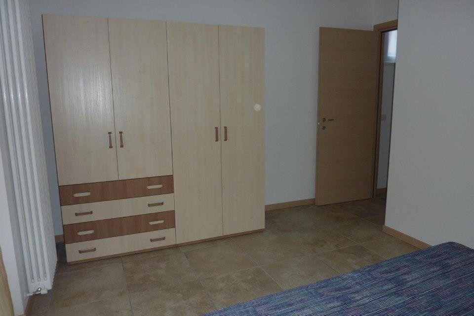 Postel nebo postele na pokoji v ubytování Residence Giuliana Dervio