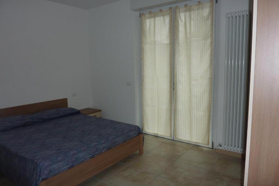 Postel nebo postele na pokoji v ubytování Residence Giuliana Dervio