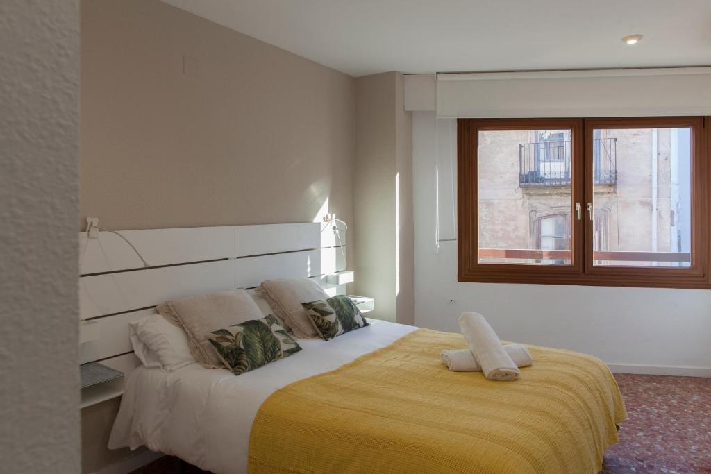Posteľ alebo postele v izbe v ubytovaní FLORIT FLATS - Apartment Torres de Quart I