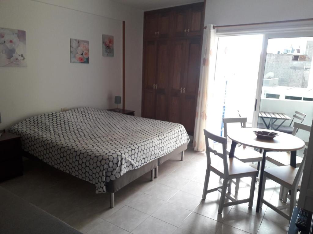 A bed or beds in a room at Edificio Gavota