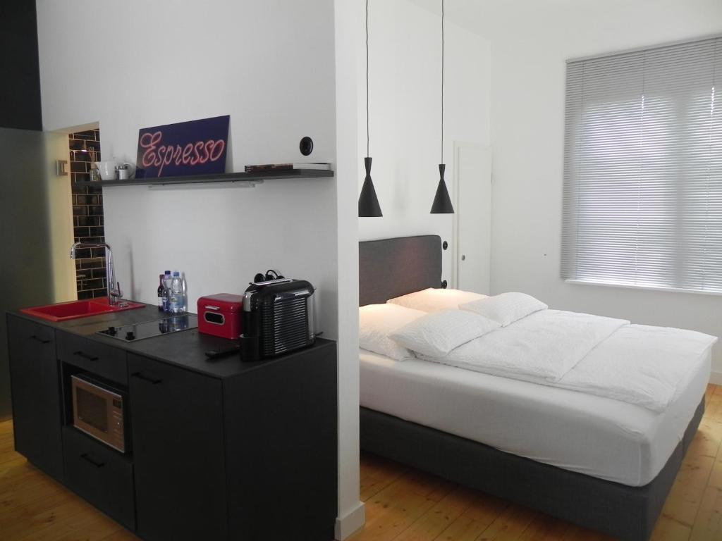 Postel nebo postele na pokoji v ubytování Milchhaus Zimmer - Tiny House