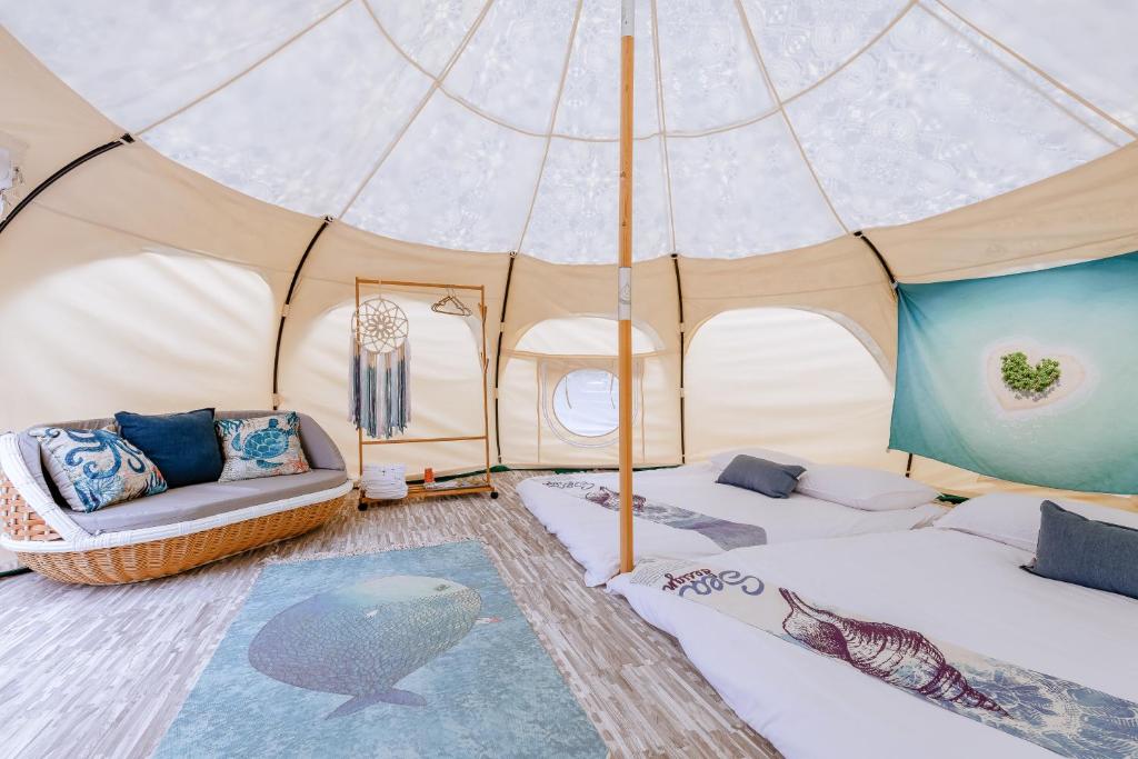 Postel nebo postele na pokoji v ubytování 踏浪星辰Camp