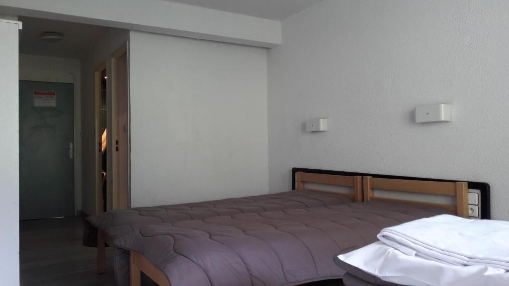 Postel nebo postele na pokoji v ubytování Centre de Vacances Le Hameau Rollot