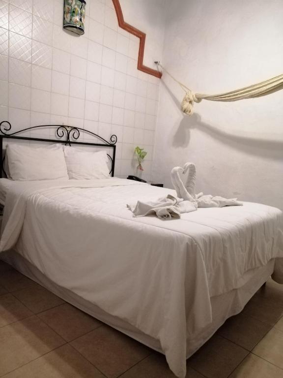 Postel nebo postele na pokoji v ubytování Hotel Reforma