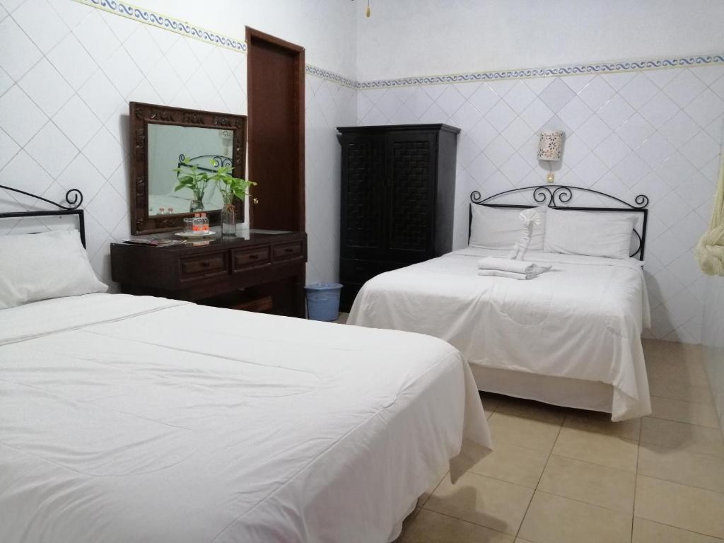 Postel nebo postele na pokoji v ubytování Hotel Reforma