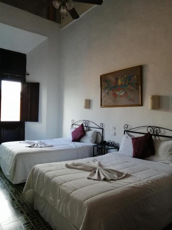Postel nebo postele na pokoji v ubytování Hotel Reforma