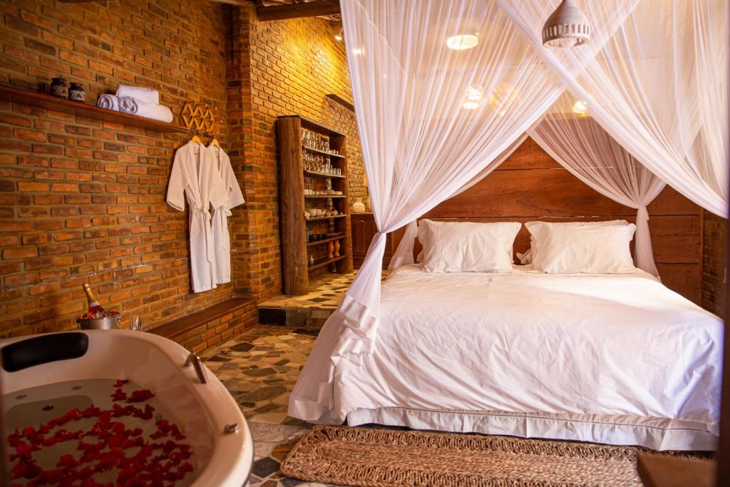 Postel nebo postele na pokoji v ubytování Casa Rabanete Trancoso