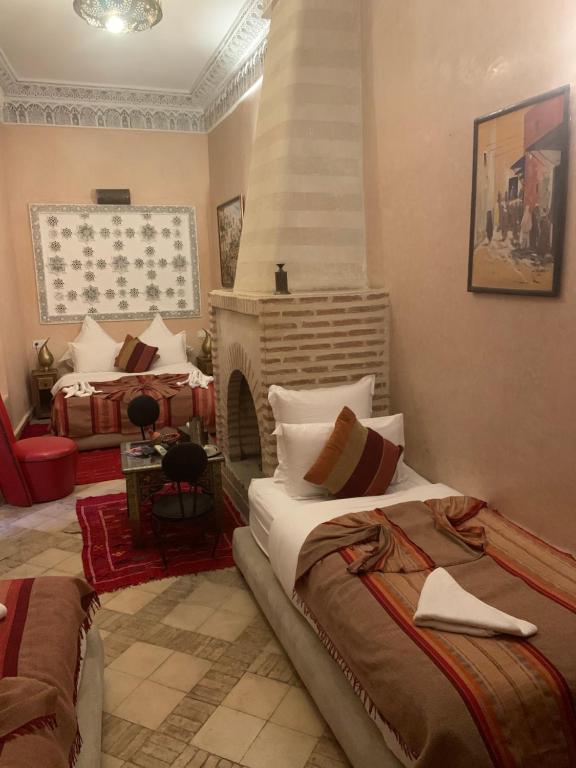 Postel nebo postele na pokoji v ubytování Riad Abaka hotel & boutique