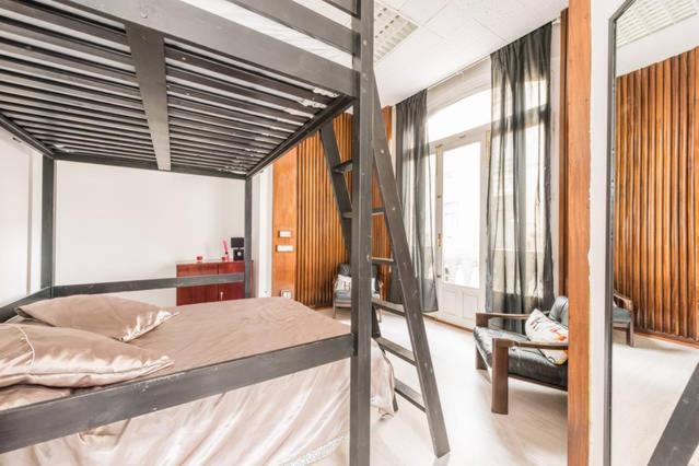 Postel nebo postele na pokoji v ubytování M&F Apartaments Gran Via