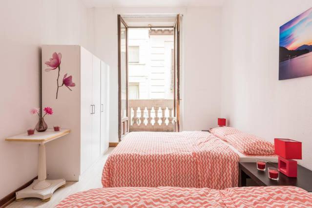 Postel nebo postele na pokoji v ubytování M&F Apartaments Gran Via