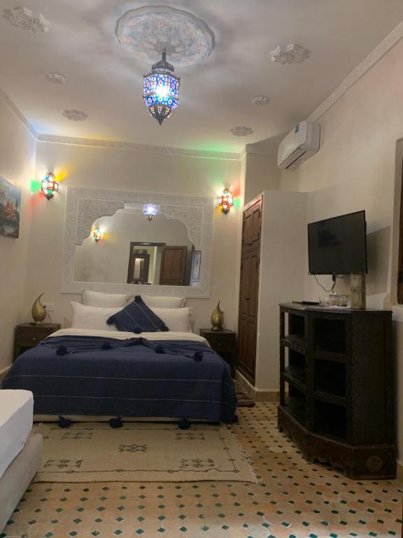 Postel nebo postele na pokoji v ubytování Riad Ghali Hotel & SPA