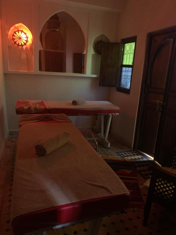 Postel nebo postele na pokoji v ubytování Riad Ghali Hotel & SPA