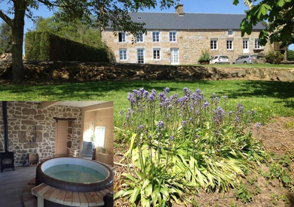 um jardim com um banco em frente a um edifício em LES ROCAILLES em La Forêt-Auvray