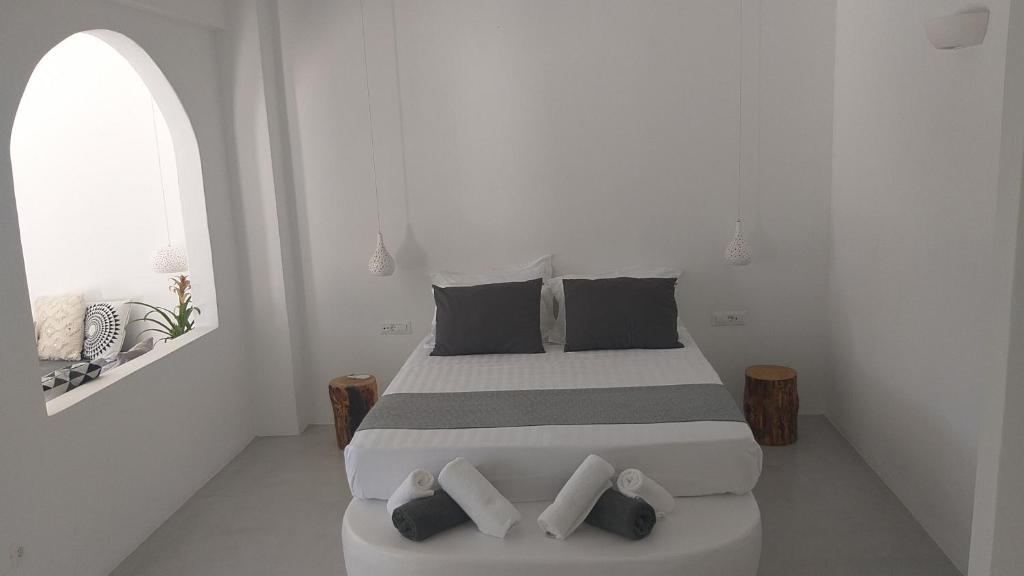 Postel nebo postele na pokoji v ubytování Filira Suites