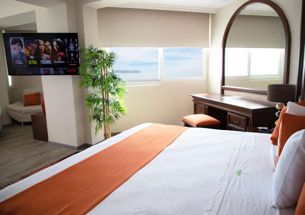 Postel nebo postele na pokoji v ubytování Hotel Lois Veracruz