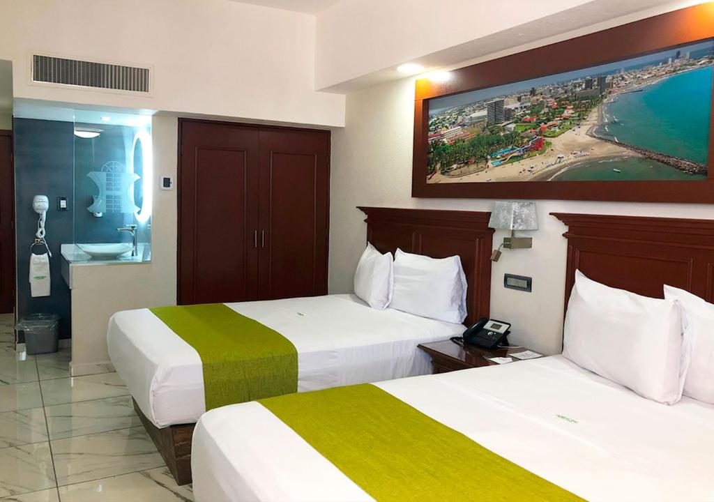 Postel nebo postele na pokoji v ubytování Hotel Lois Veracruz