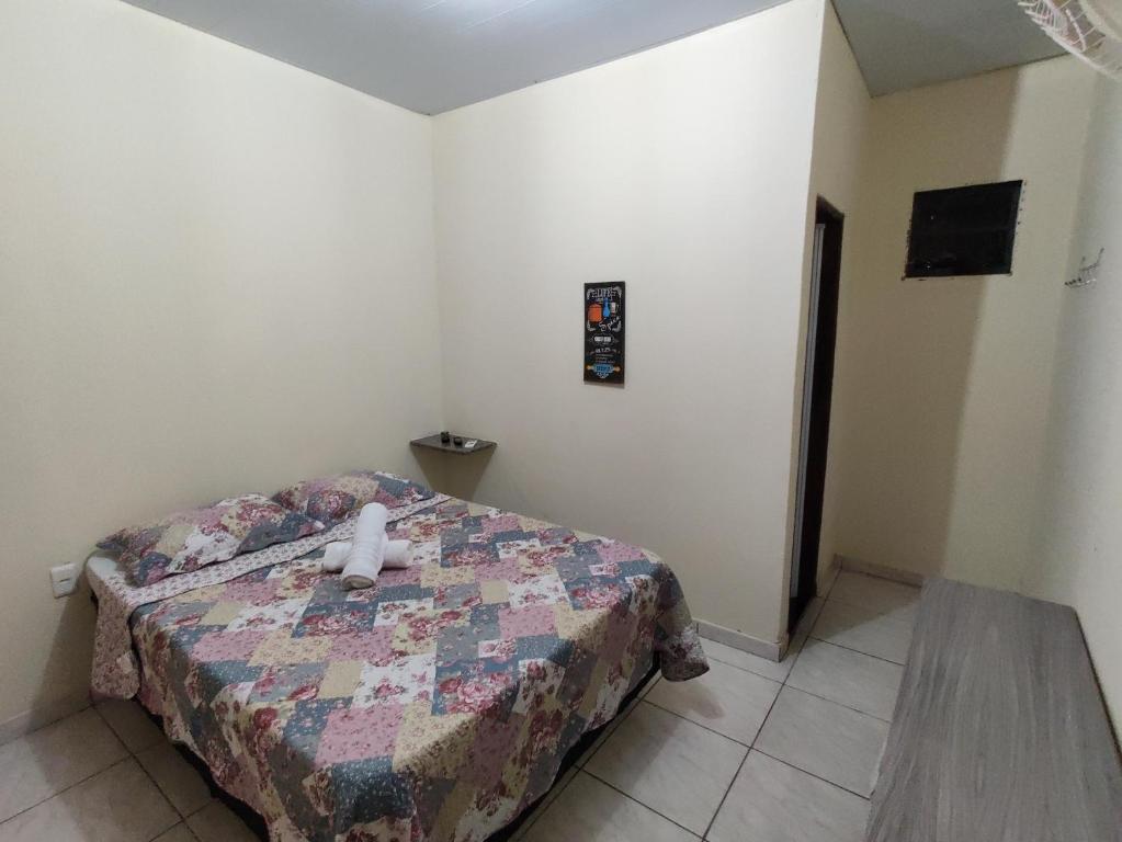 Uma cama ou camas num quarto em Pousada do Professor