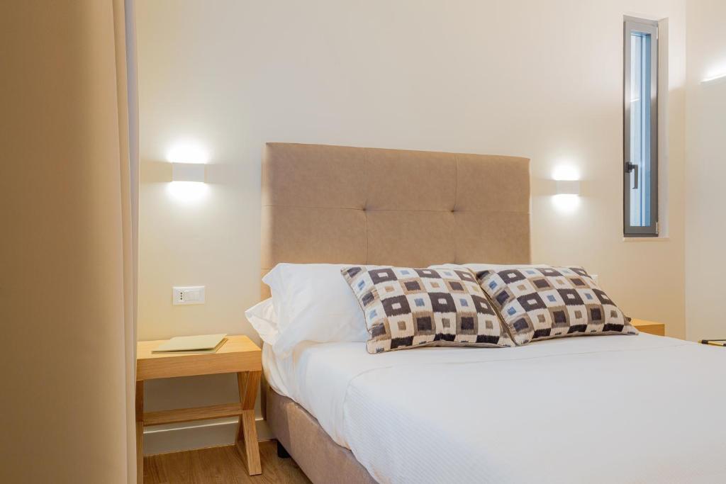 Postel nebo postele na pokoji v ubytování Hotel Politeama
