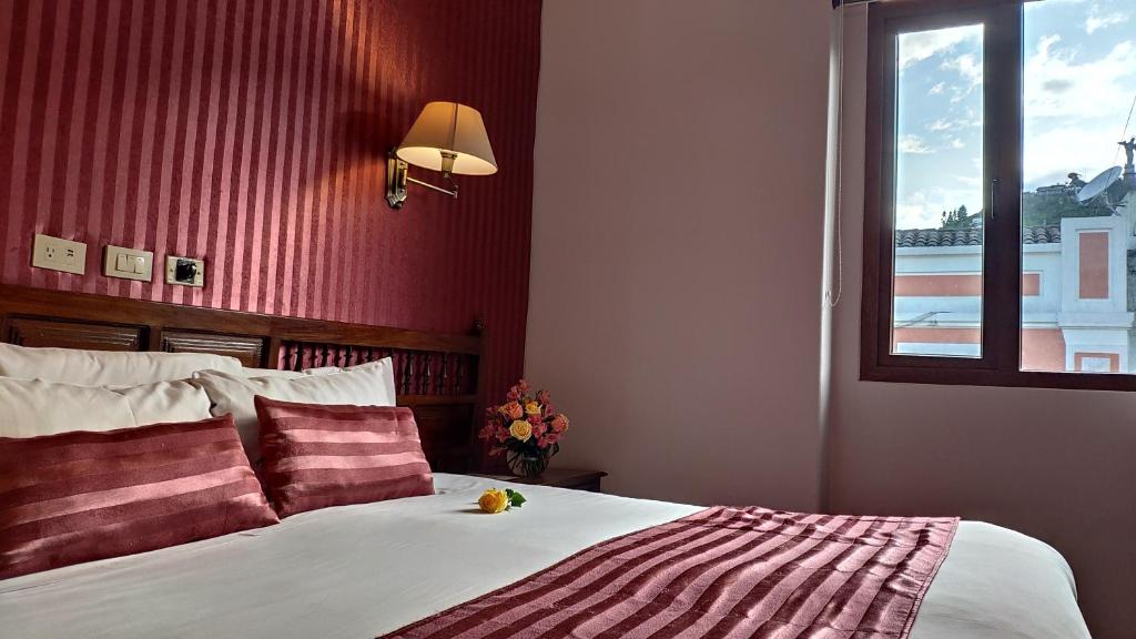 Postel nebo postele na pokoji v ubytování Hotel Real Audiencia