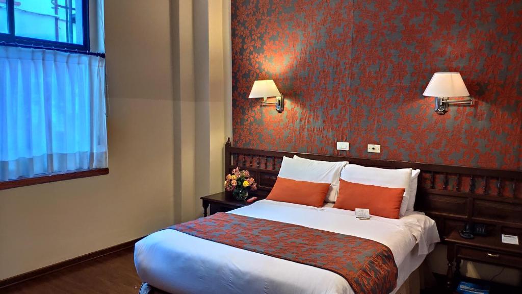 Postel nebo postele na pokoji v ubytování Hotel Real Audiencia