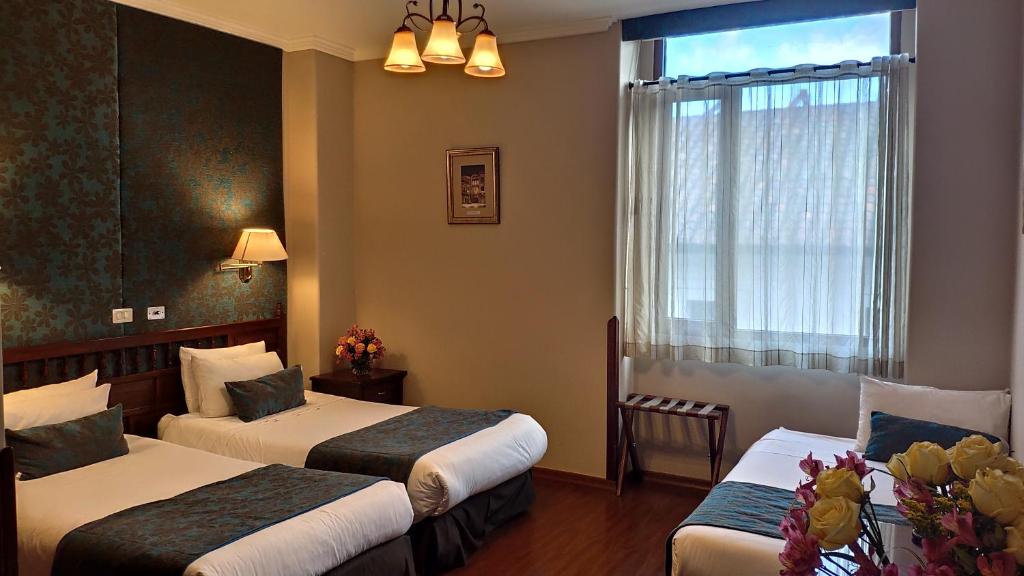 Postel nebo postele na pokoji v ubytování Hotel Real Audiencia
