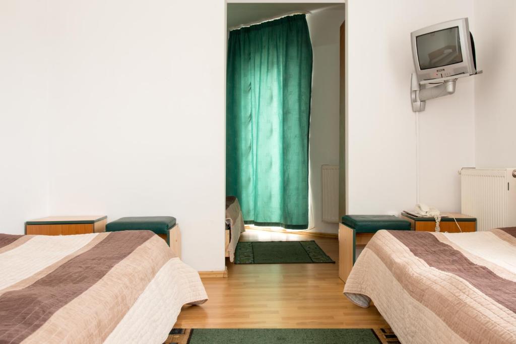 Postel nebo postele na pokoji v ubytování Hotel Beta
