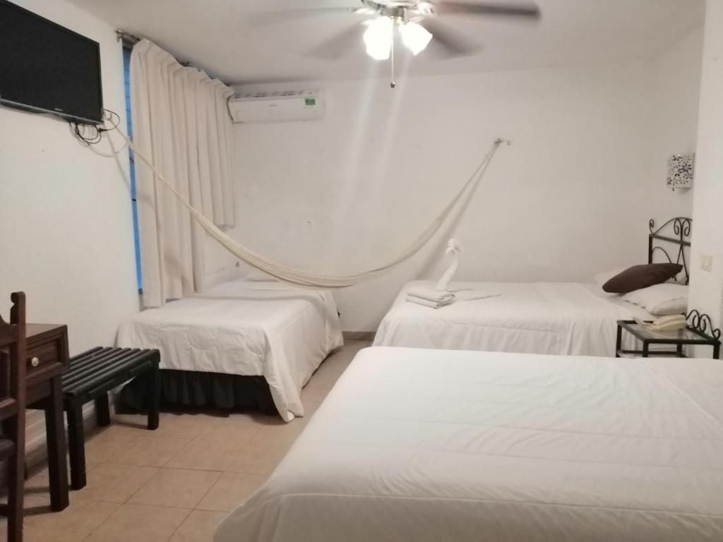 Postel nebo postele na pokoji v ubytování Hotel Reforma