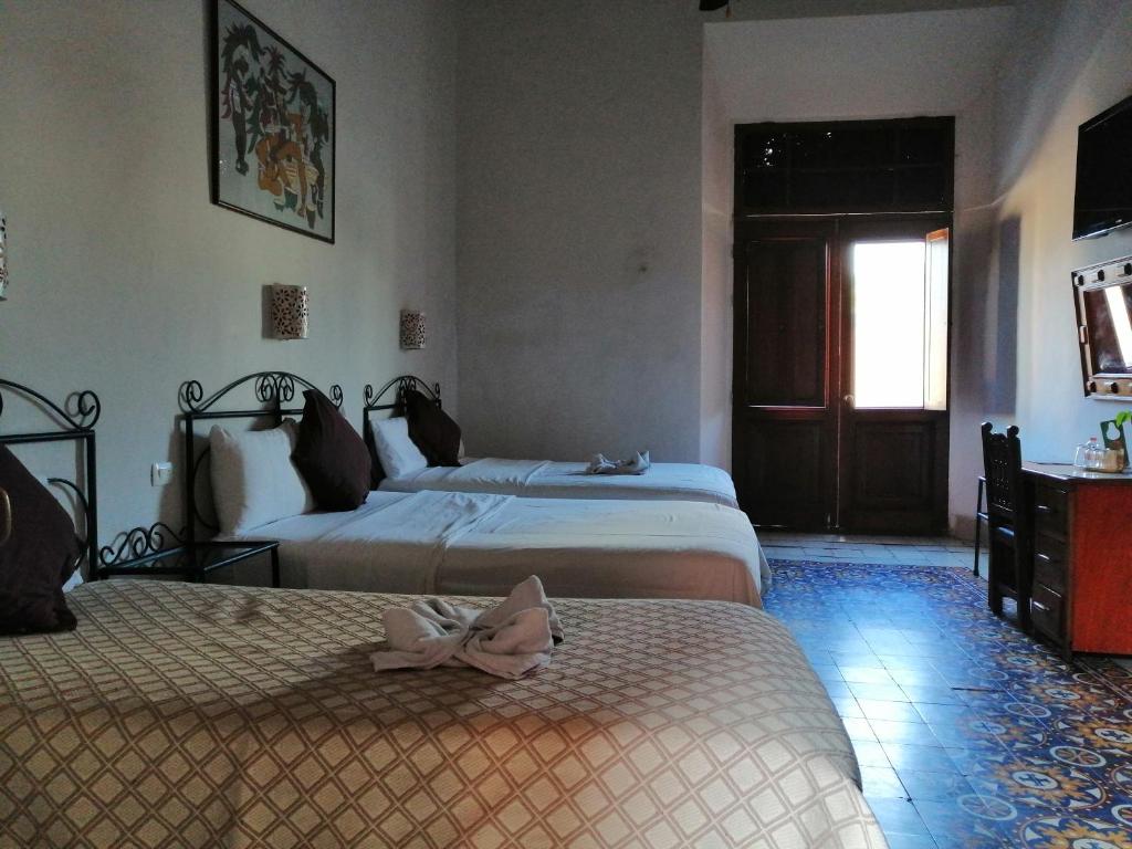 Postel nebo postele na pokoji v ubytování Hotel Reforma