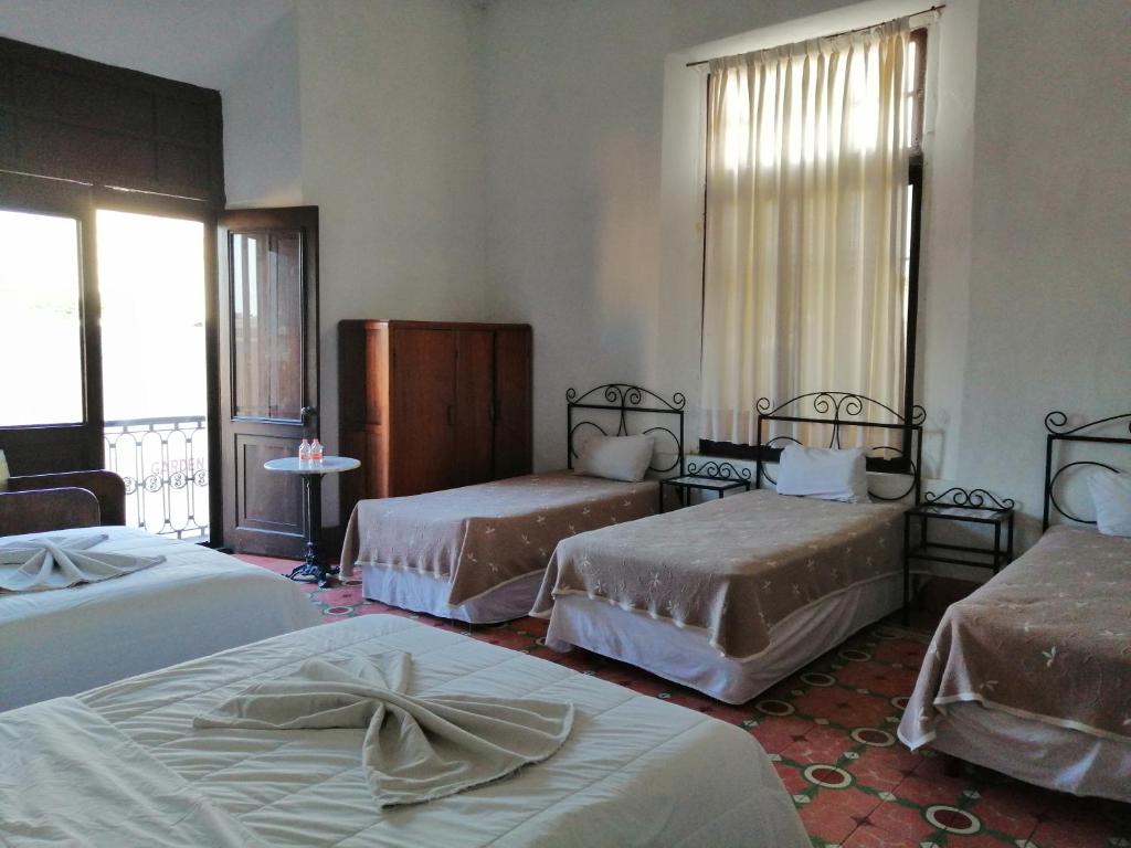 Postel nebo postele na pokoji v ubytování Hotel Reforma