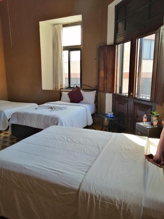 Postel nebo postele na pokoji v ubytování Hotel Reforma