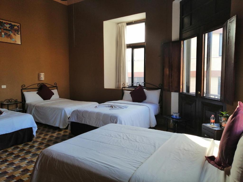 Postel nebo postele na pokoji v ubytování Hotel Reforma