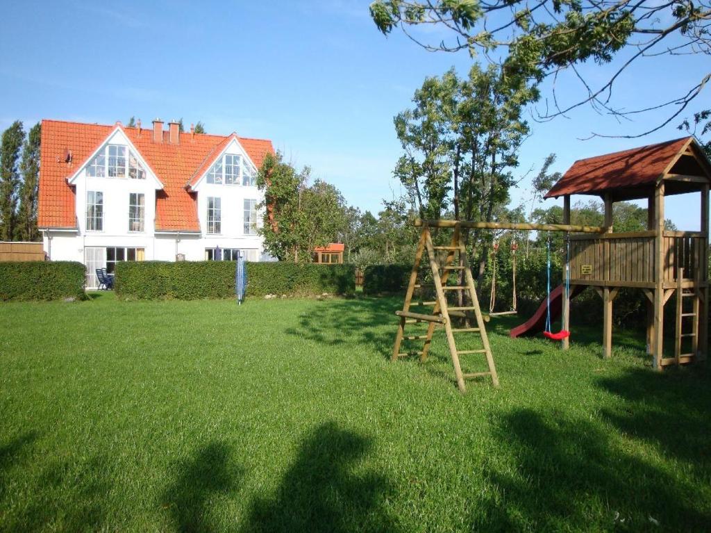 a playground in the yard of a house at VALIF6001-Haus-Lindenallee-II in Vadersdorf
