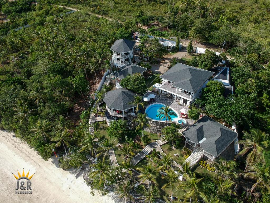 an aerial view of a house on the beach at J&R Residence in Anda