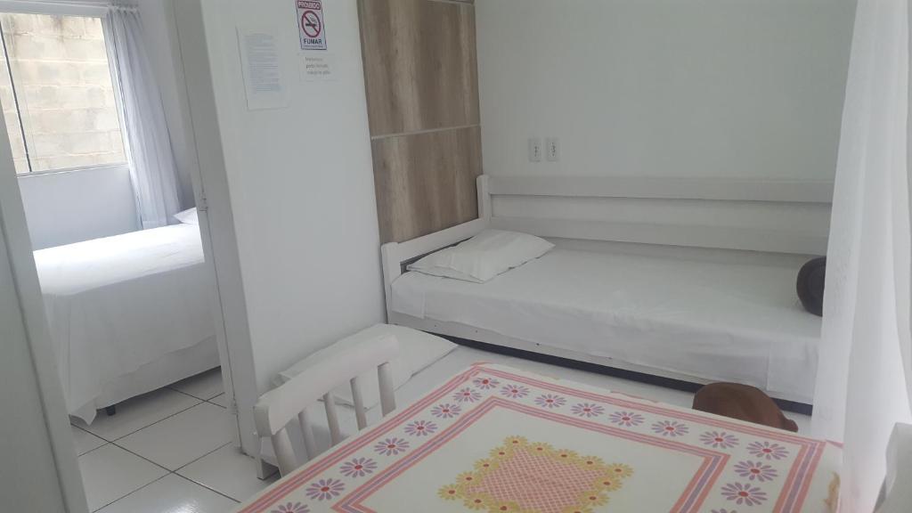 Postel nebo postele na pokoji v ubytování Residencial Neto