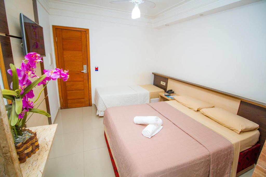 Postel nebo postele na pokoji v ubytování Shangrilá - Rede Soberano