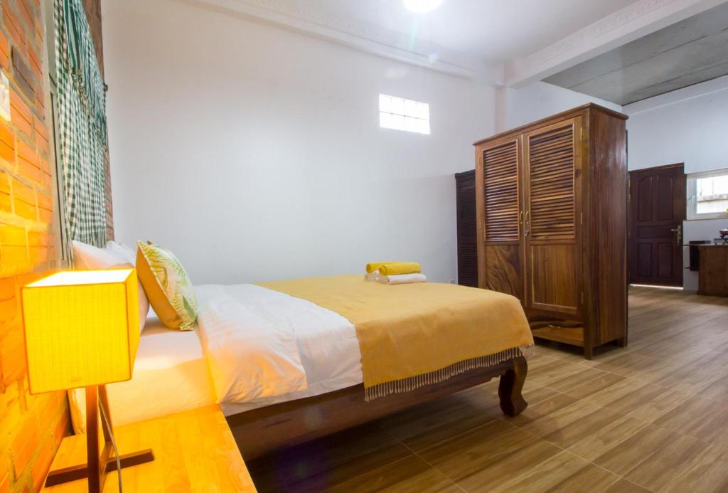 Postel nebo postele na pokoji v ubytování ANGKOR DINO HOME