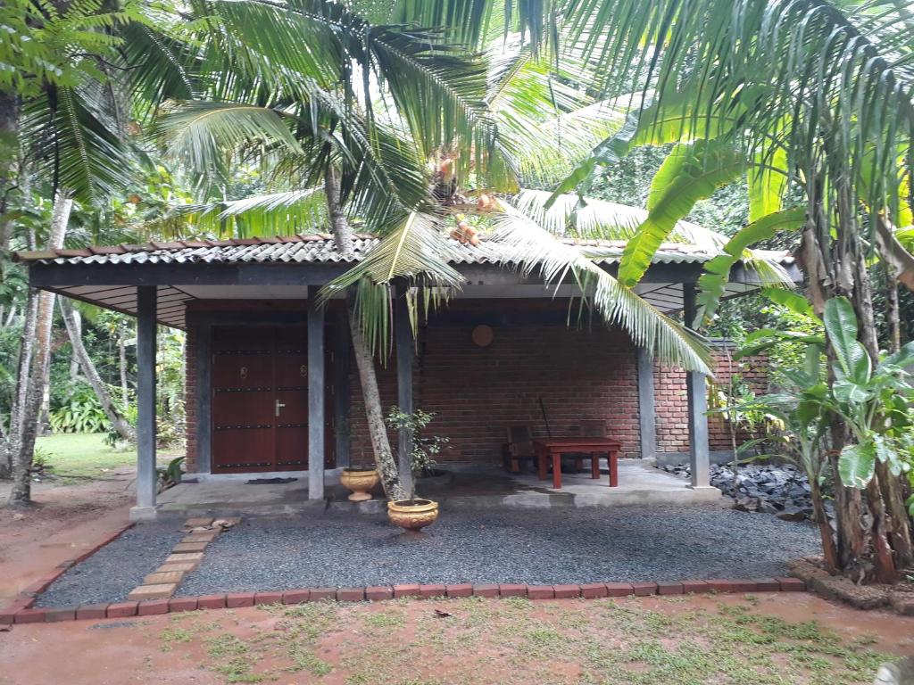 a small house with a table in front of it at Selnara Private Luxury Villa and Ayurveda Spa in Bentota